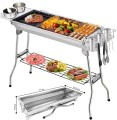 Srebrny grill polowy ze stali nierdzewnej łączący funkcję klasycznego rusztu oraz metalowej patelni grillowej
